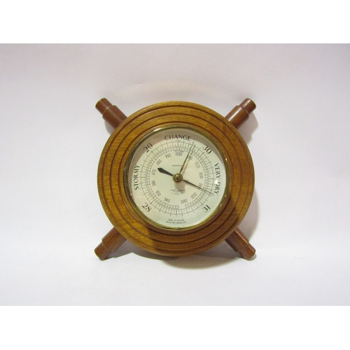 4315 - A Shortland Smiths barometer in the form of a ship's wheel.  34cm overall diameter