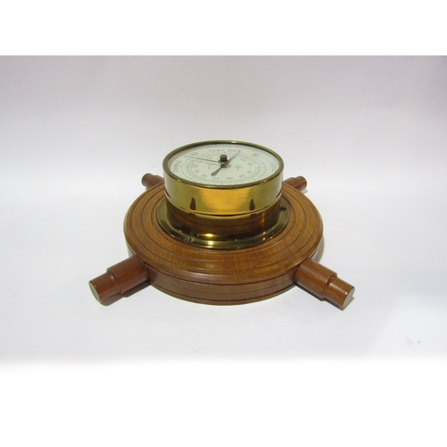 4315 - A Shortland Smiths barometer in the form of a ship's wheel.  34cm overall diameter