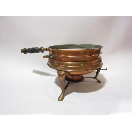 4321 - A copper warmer and a wooden handled coffee pot and two brass chestnut roasters