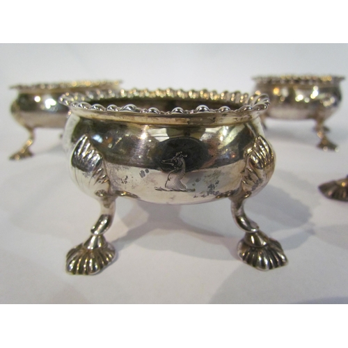 4328 - A set of four oval silver salts gadrooned edge, (no liners) raised on four outswept feet, hallmarks ... 