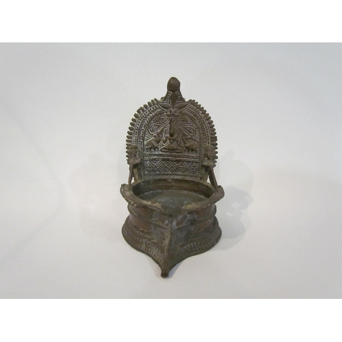 4330 - An Indian brass vessel for oil, (tallest point 13cm)