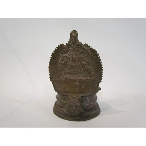 4330 - An Indian brass vessel for oil, (tallest point 13cm)