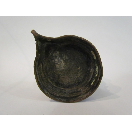 4330 - An Indian brass vessel for oil, (tallest point 13cm)