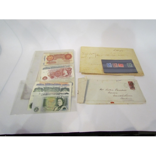 4337 - A collection of banknotes, mainly British, including £5 note. GB postage stamps and an indenture, sa... 