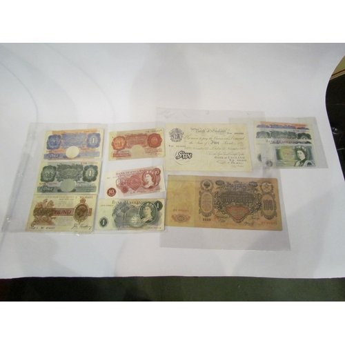 4337 - A collection of banknotes, mainly British, including £5 note. GB postage stamps and an indenture, sa... 