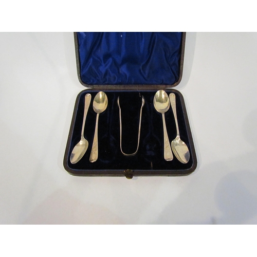 4348 - A cased set of four silver teaspoons and matching tongs, Sheffield,