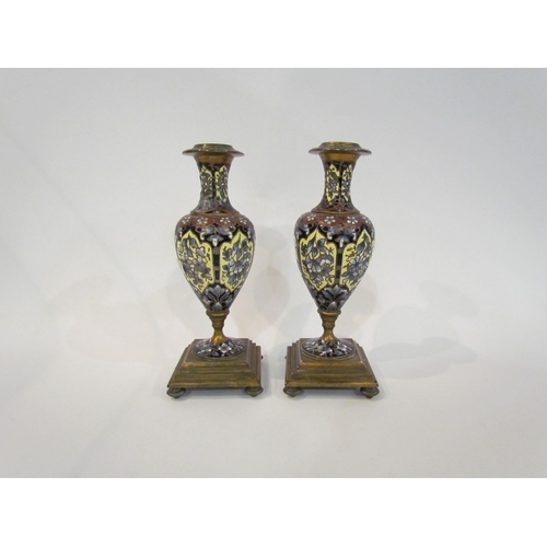 4366 - A pair of Champlevé brass mounted vases/candlesticks of baluster form, 19cm tall