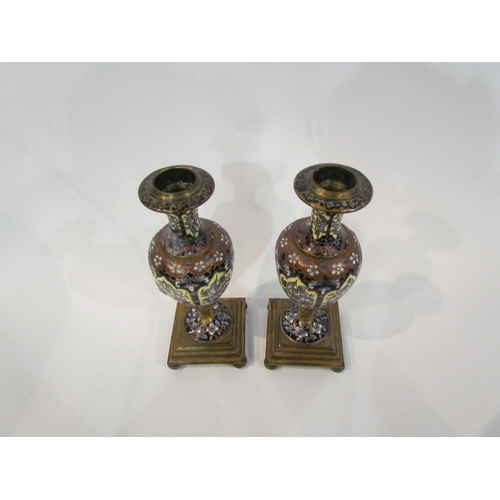 4366 - A pair of Champlevé brass mounted vases/candlesticks of baluster form, 19cm tall