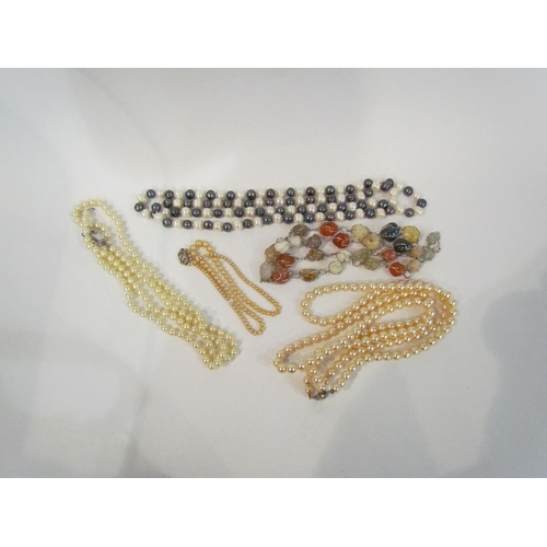 4371 - A small seletion of necklaces including modern and simulated pearls together with a mixed hard stone... 