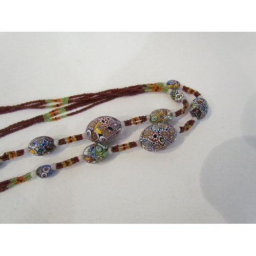 4378 - A venetian glass bead necklace with tasselled end