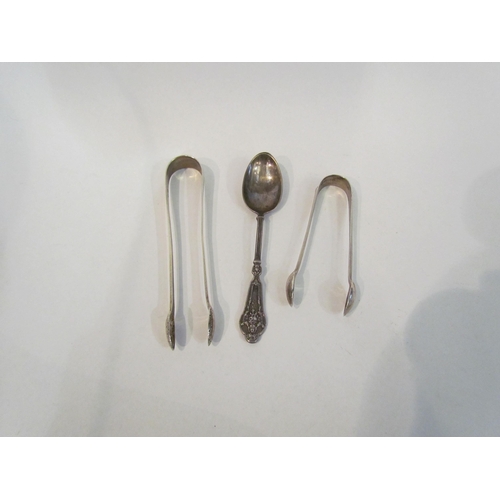 4382 - Two pairs of silver sugar tongs and a silver spoon (3)