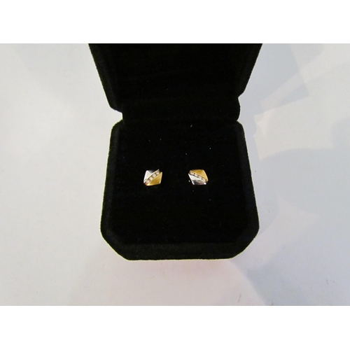 4390 - A pair of 18ct two colour gold diamond set studs   (C)