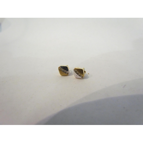 4390 - A pair of 18ct two colour gold diamond set studs   (C)