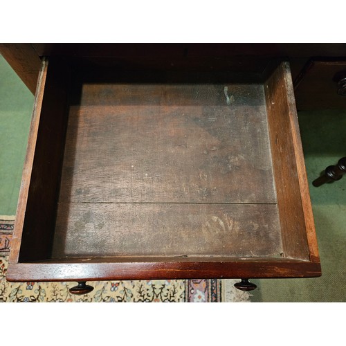 4001 - A Victorian mahogany round cornered writing table, the gilt tooled leather writing surface over two ... 