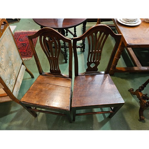 4180 - A harlequin set of six Georgian solid-seat dining chairs