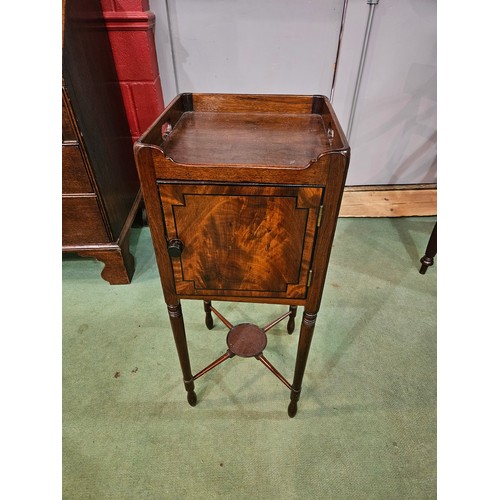 4201 - An early Victorian flame mahogany nightstand, tray top, single door with ebony inlay, turned support... 