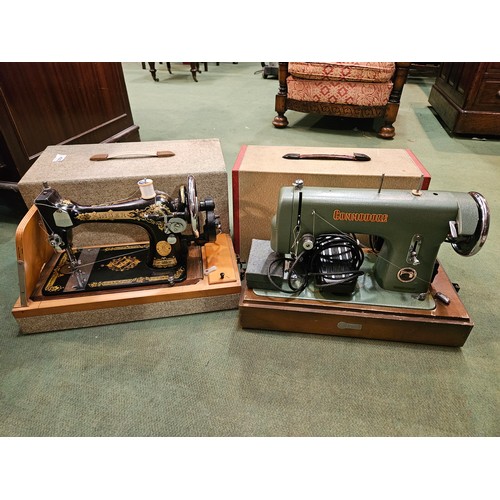 4202 - A singer hand crank sewing machine together with a Commodore electric exmple, both cased