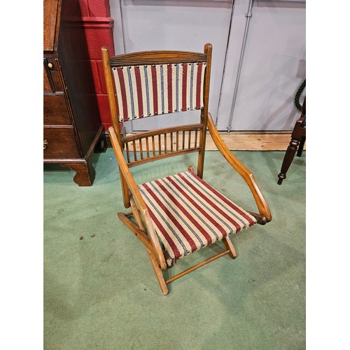 4238 - A stained beech framed folding deck style chair