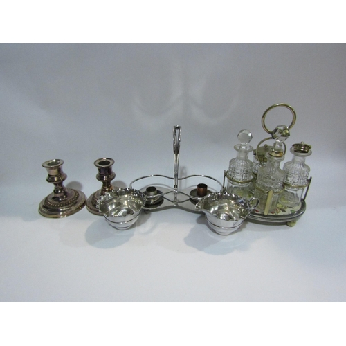 4403 - A pair of plated on copper candlesticks, 11cm tall, an EPNS sucrier and jug, cruet etc.