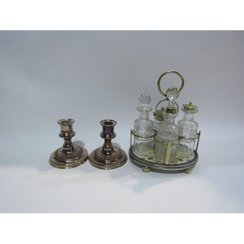 4403 - A pair of plated on copper candlesticks, 11cm tall, an EPNS sucrier and jug, cruet etc.