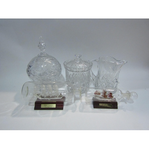 4408 - A crystal glass jug, biscuit barrel, ships in bottles and covered bowl (5)