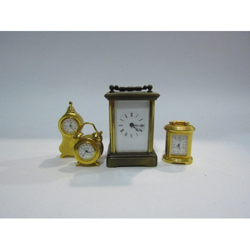 4413 - A miniature carriage clock, 8.5cm tall, and three novelty miniature timepieces (4)