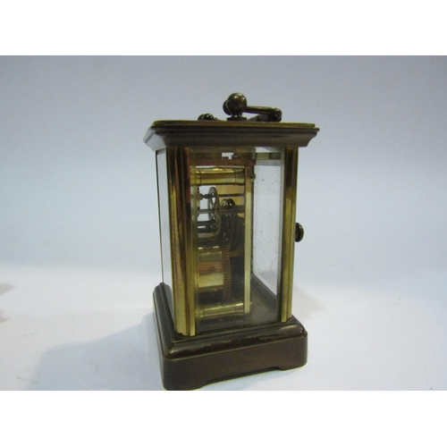 4413 - A miniature carriage clock, 8.5cm tall, and three novelty miniature timepieces (4)