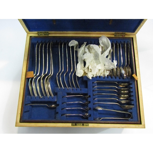 4440 - A near complete canteen of cutlery contained in an oak case