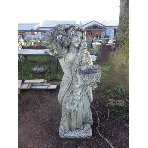 7001 - A weathered composition statue of a maiden with treasure chest, 55