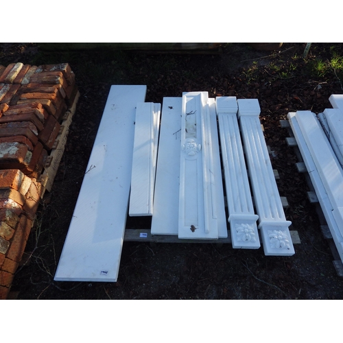 7006 - A decorative white marble fire surround