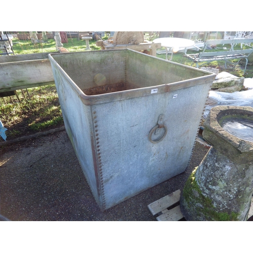 7013 - A large riveted gavanised water tank with loop handles, 34