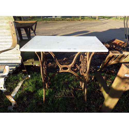 7026 - A cast iron Singer treadle base with marble top  (R)  £30