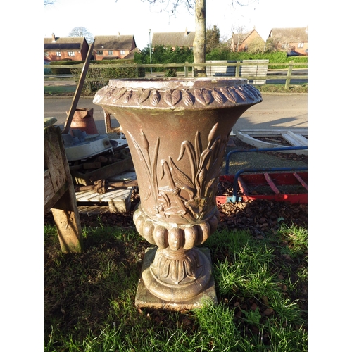 7029 - A late Victorian salt glazed urn with foliate relief to body, 37