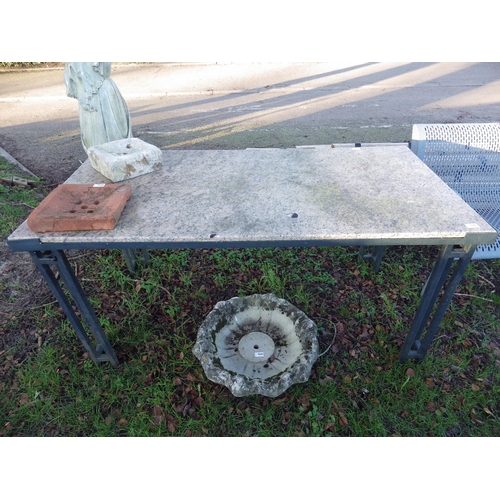 7043 - A metal framed, granite top table, 30