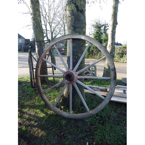 7049 - An iron rimmed wooden cart wheel, 56