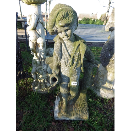 7055 - A composition figure of a boy on fence, 30