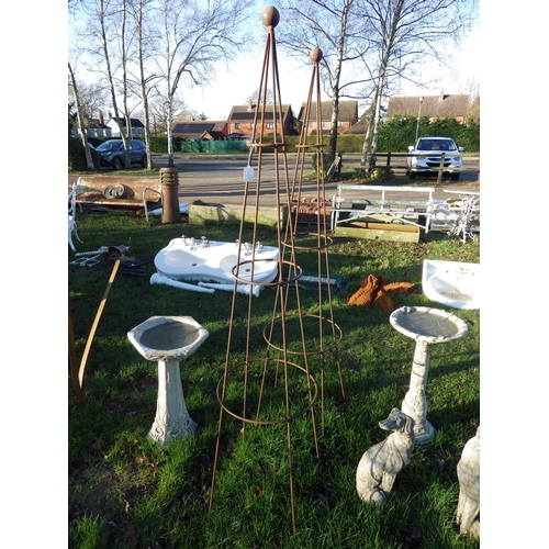 7104 - A pair of steel ball top obelisks