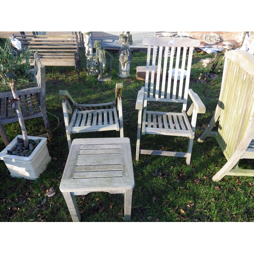 7112 - A pair of hardwood adjustable garden chairs, one chair a/f and matching low table