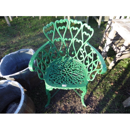 7138 - A green painted alloy garden chair