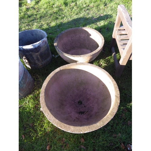 7150 - A pair of red sandstone circular planters, 24.5