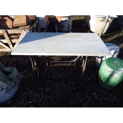 7206 - A treadle base table with marble top  (R)  £30