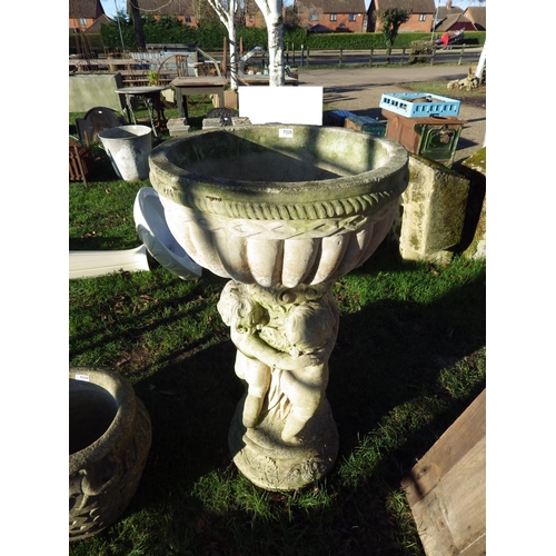 7235 - A composition gadrooned planter on three cherub base, 41