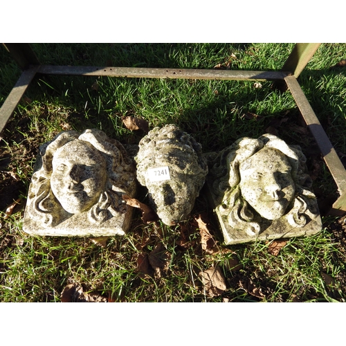 7241 - Two plaques of maidens heads and another