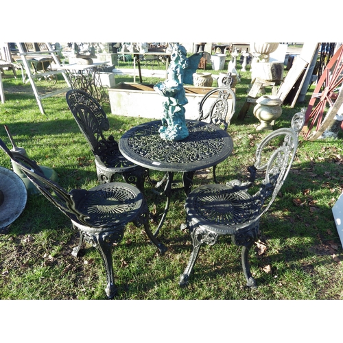 7308 - A black painted decorative alloy garden table and four chairs  (E)  £60-90