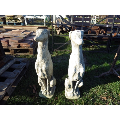 7329 - A pair of composition seated dogs, 29