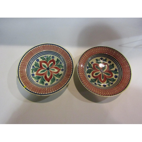 4033 - A pair of Dutch spongeware dishes, hairline crack and chip to one, largest 28cm diameter