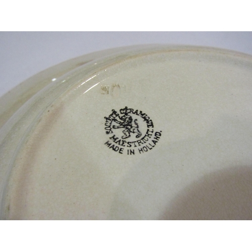 4033 - A pair of Dutch spongeware dishes, hairline crack and chip to one, largest 28cm diameter