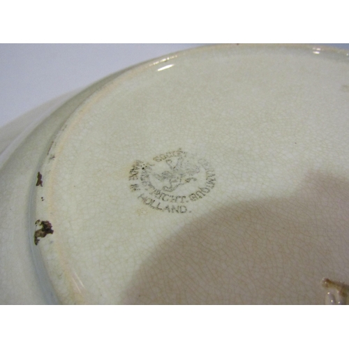 4033 - A pair of Dutch spongeware dishes, hairline crack and chip to one, largest 28cm diameter