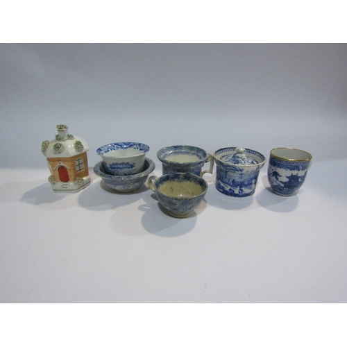 4131 - A Victorian Staffordshire cottage money box and six pieces of Victorian blue and white pottery inclu... 