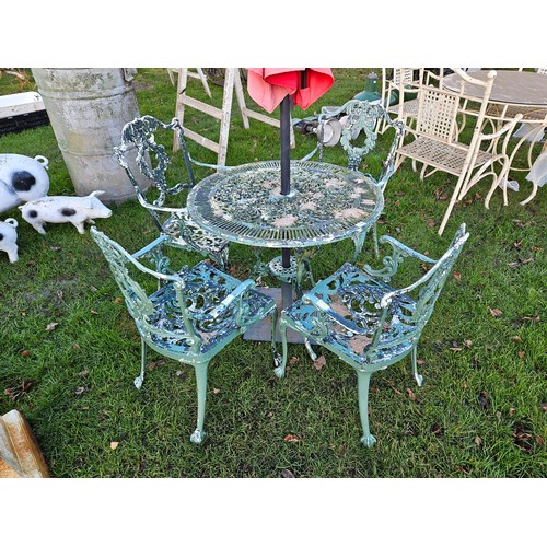 7355 - A decorative alloy garden table and four chairs